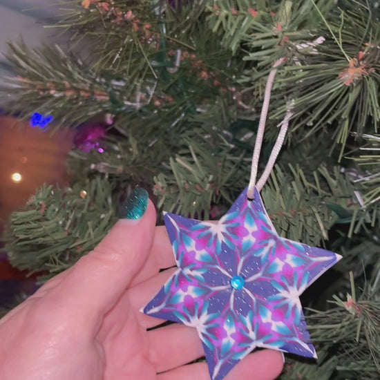 6 pointed star with sparkle blue, turquoise, white, purple, lavender and fuschia canes,